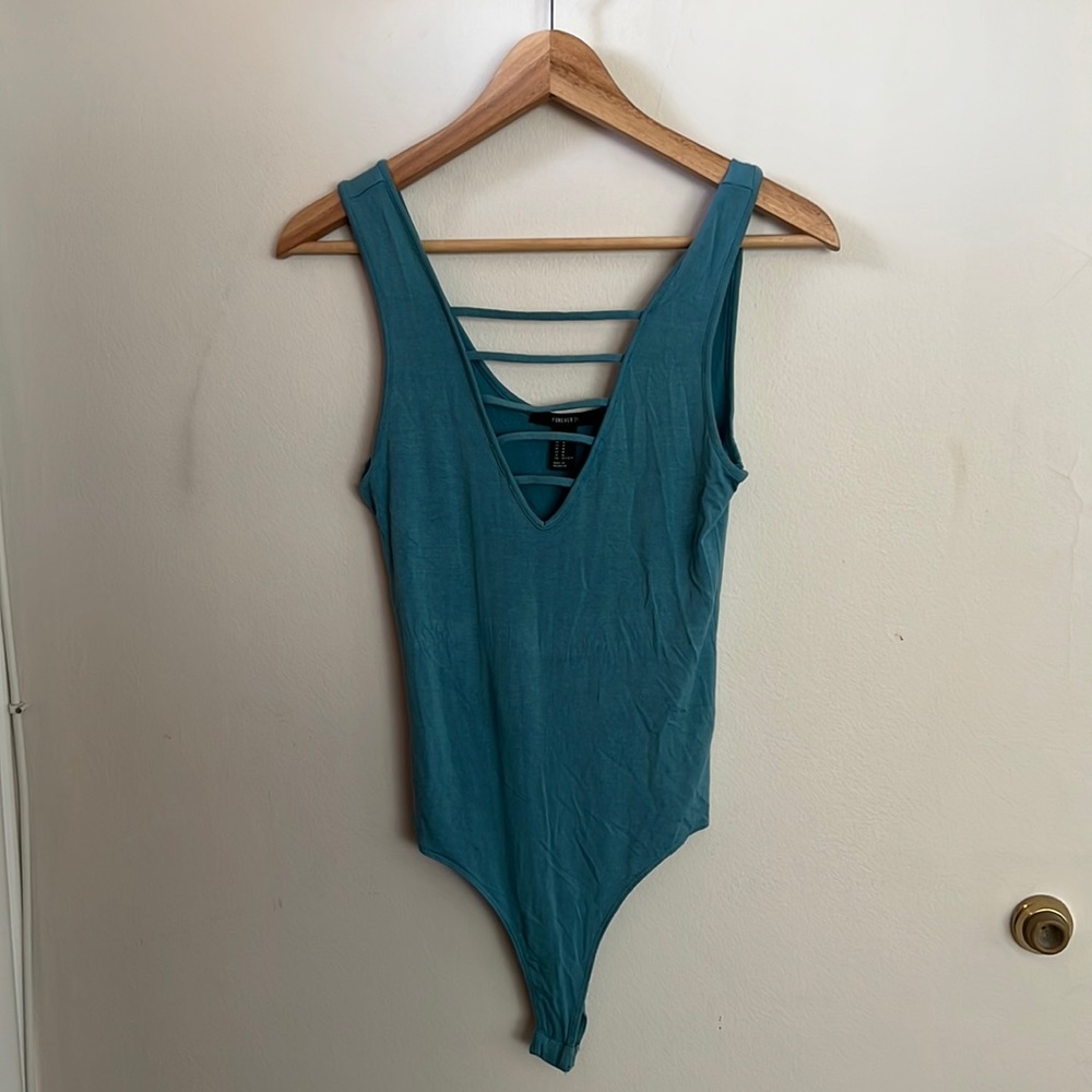 Blue bodysuit snaps on the bottom